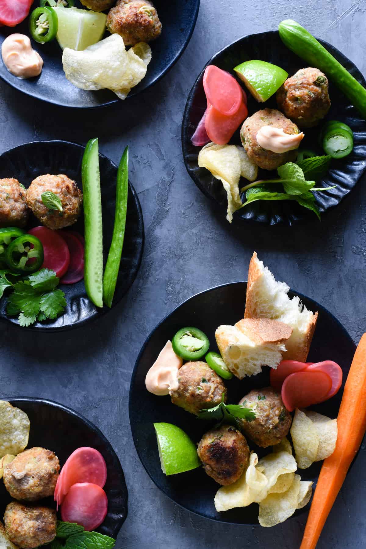 This Banh Mi Meatball Snack Dinner is a healthful platter of fresh ingredients that the whole family will love. Turkey meatballs, fresh and pickled veggies, bread, potato chips and dipping sauce - it's a fun meal that comes together easily. | foxeslovelemons.com