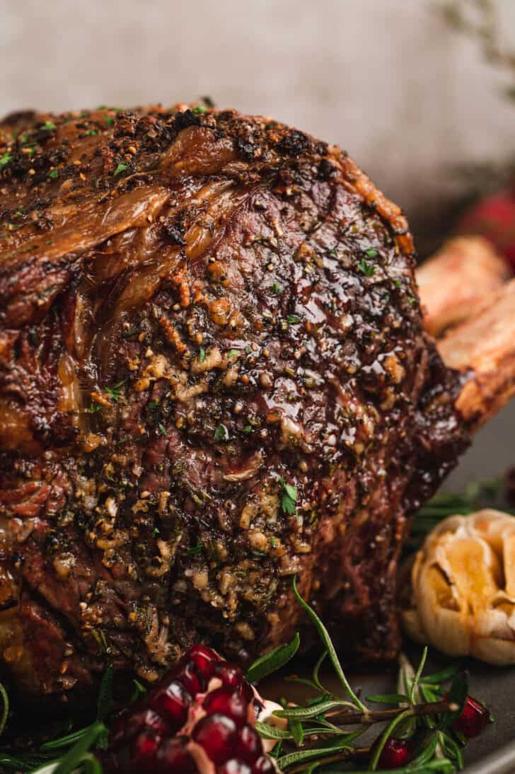 Closeup on a standing rib roast covered in the best prime rib rub.