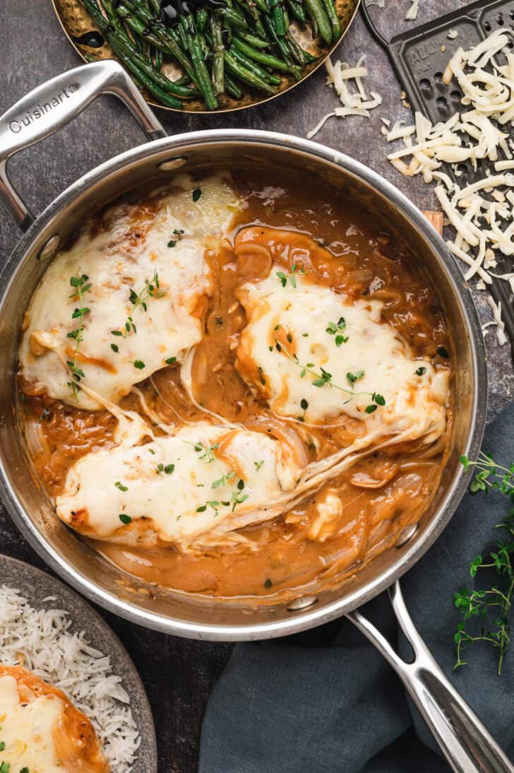 French Onion Chicken in a stainless steel skillet.