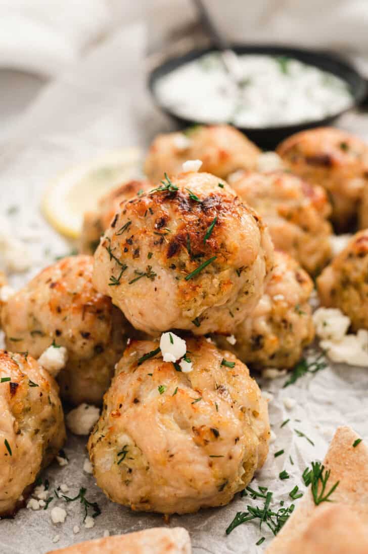 Ground chicken meatballs sprinkled with herbs and crumbled feta.