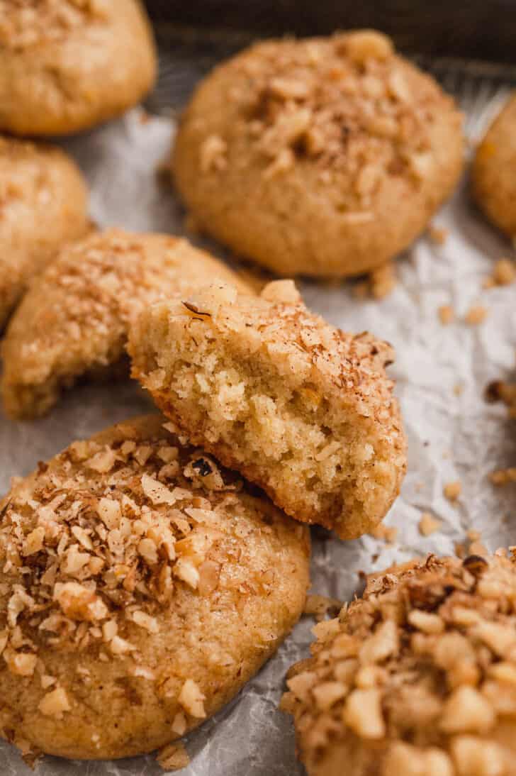 Melomakarona cookies in close up, with one split in half.