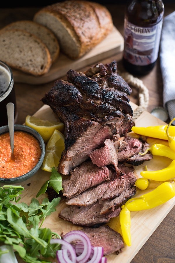 Grilled Lamb Sandwich Platter - Change up your grilling game with a boneless leg of lamb! It cooks in the same amount of time as a thick steak, and has a rich delicious flavor. Pile sandwich fixings, zesty feta spread, chimichurri and rye bread onto a big board, and dinner is served! | foxeslovelemons.com