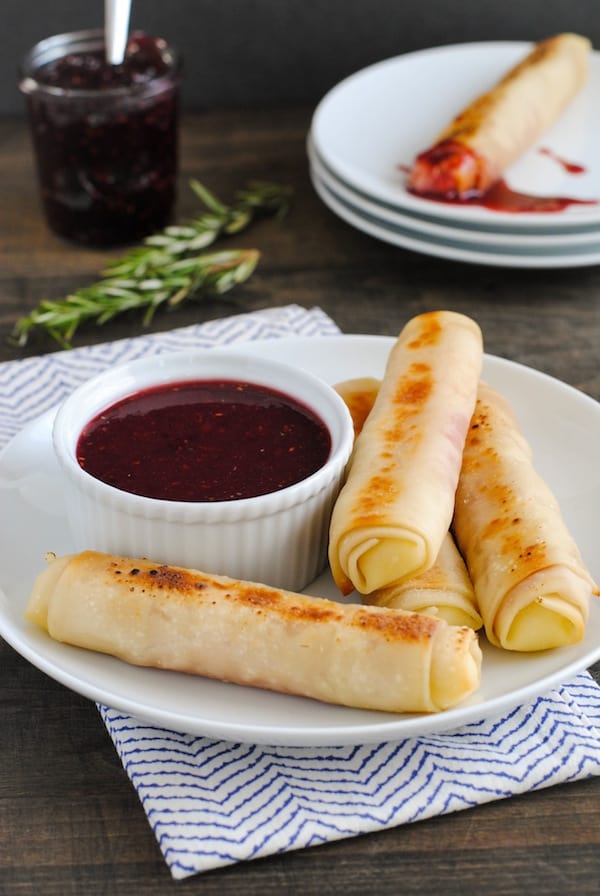 Ham & Mozzarella Sticks with Raspberry-Dijon Dipping Sauce - The appetizer version of a Monte Cristo sandwich! Gooey cheesy and ham sticks dipped in spicy-sweet sauce. Make two, or enough for a crowd! | foxeslovelemons.com