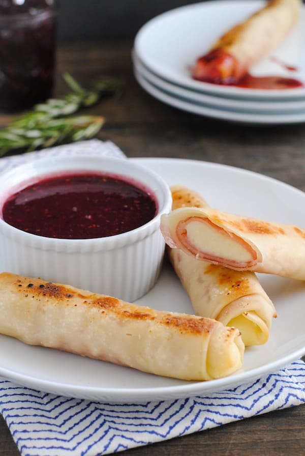 Ham & Mozzarella Sticks with Raspberry-Dijon Dipping Sauce - The appetizer version of a Monte Cristo sandwich! Gooey cheesy and ham sticks dipped in spicy-sweet sauce. Make two, or enough for a crowd! | foxeslovelemons.com