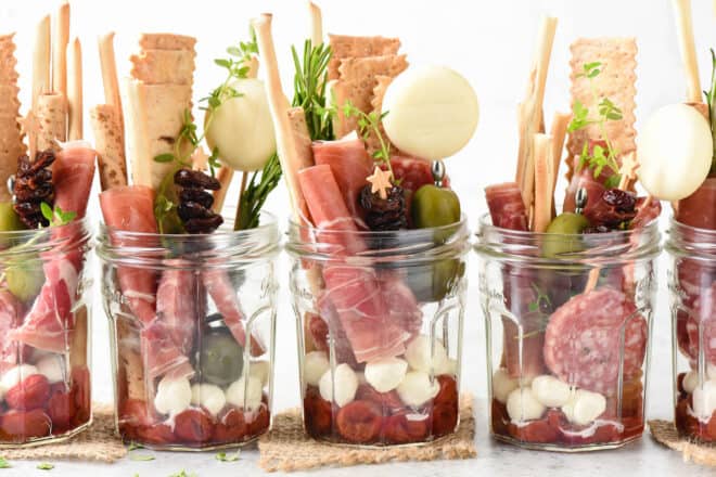 A row of five jarcuterie servings.