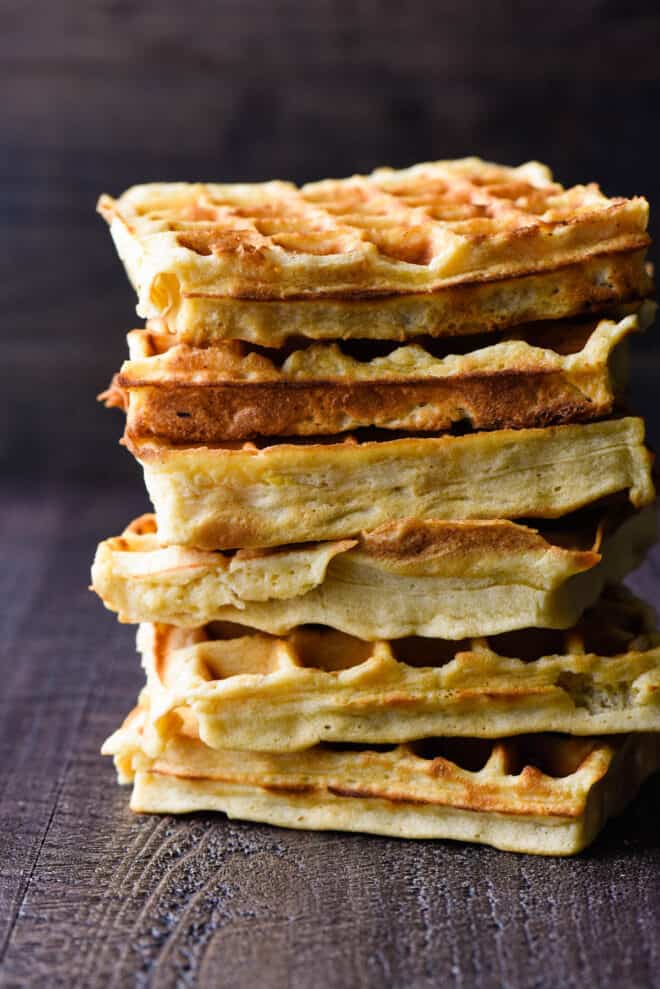 Stack of golden brown, square Belgian waffles.