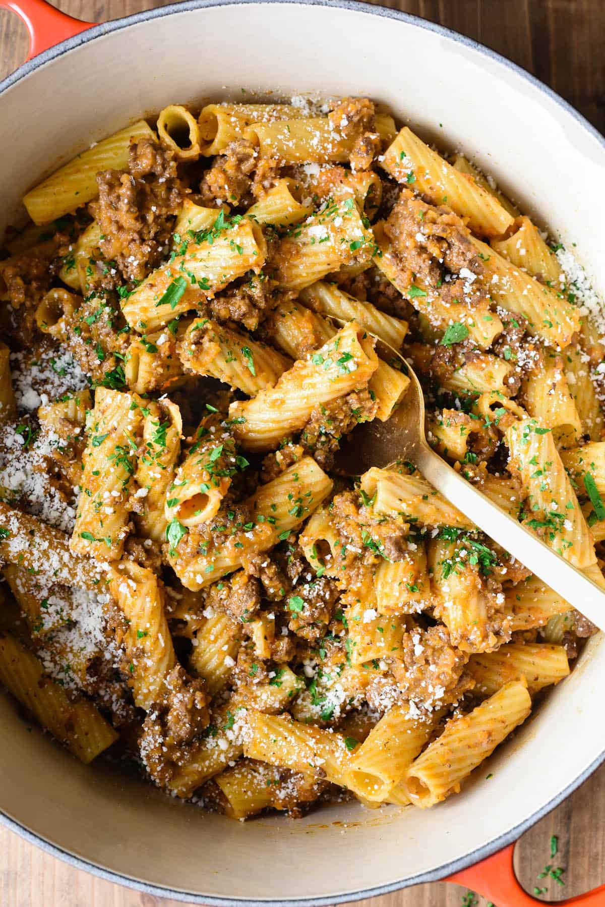 Overhead photo of Dutch oven filled with rigatoni bolognese.