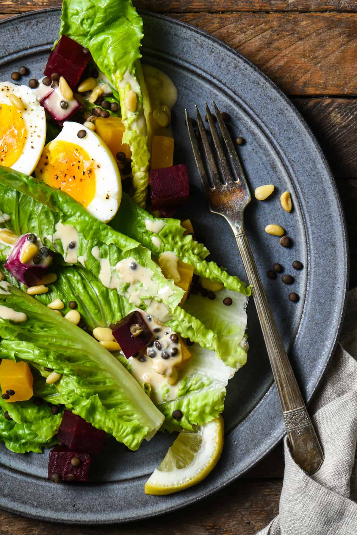 This Lentil & Roasted Beet Salad is a big plate of goodness that is hearty enough to be a complete meal. Serve with easy homemade Maple-Tahini Dressing. | foxeslovelemons.com