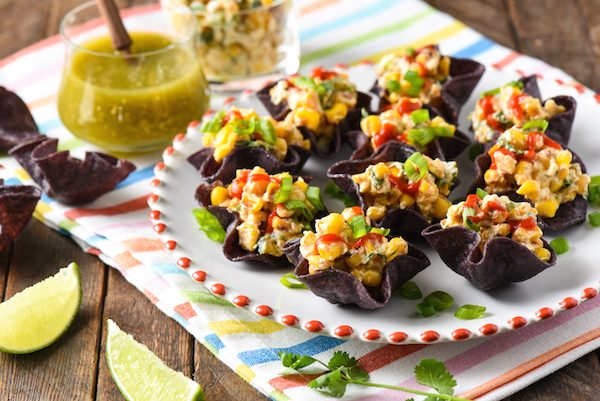 Salsa Verde Elote Bites - Creamy Mexican street food-style corn served in mini tortilla bowls. A perfect EASY party bite! | foxeslovelemons.com