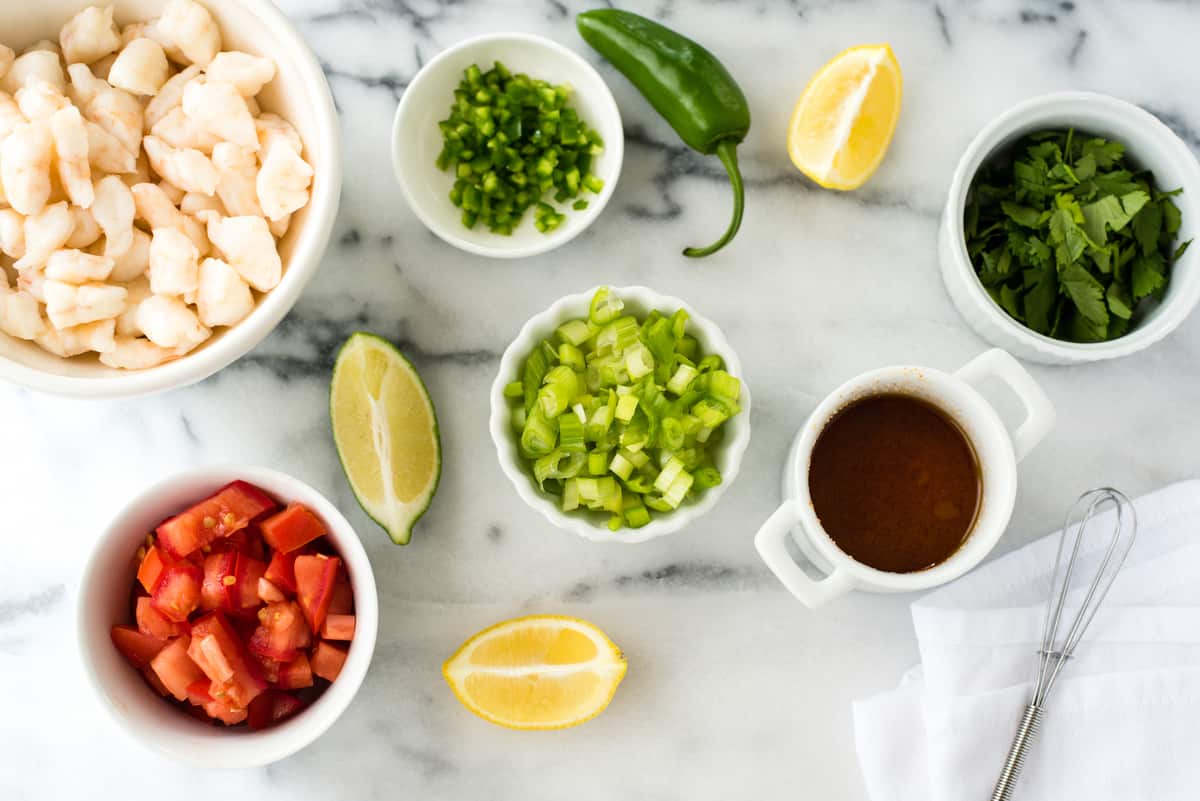 Fresh, healthy and easy! This Shrimp Ceviche recipe will wow as a restaurant-quality party appetizer that is so simple to make at home. | foxeslovelemons.com