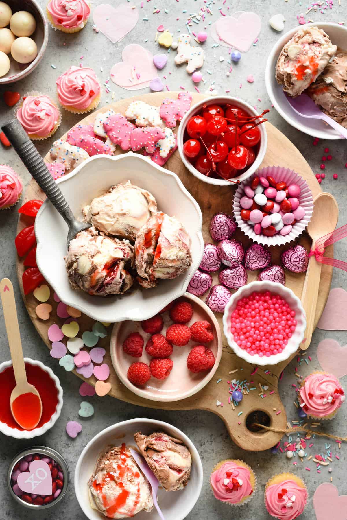 Make the holiday extra sweet with this dreamy Valentine's Day Dessert Board featuring ice cream, fruit, candies, chocolate and sprinkles! | foxeslovelemons.com