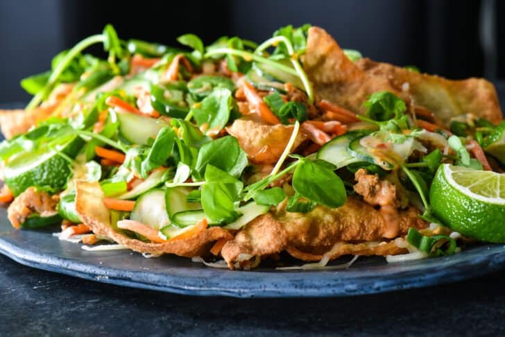 Crispy Asian chips topped with ground pork, pickled veggies, herbs and spicy mayo.